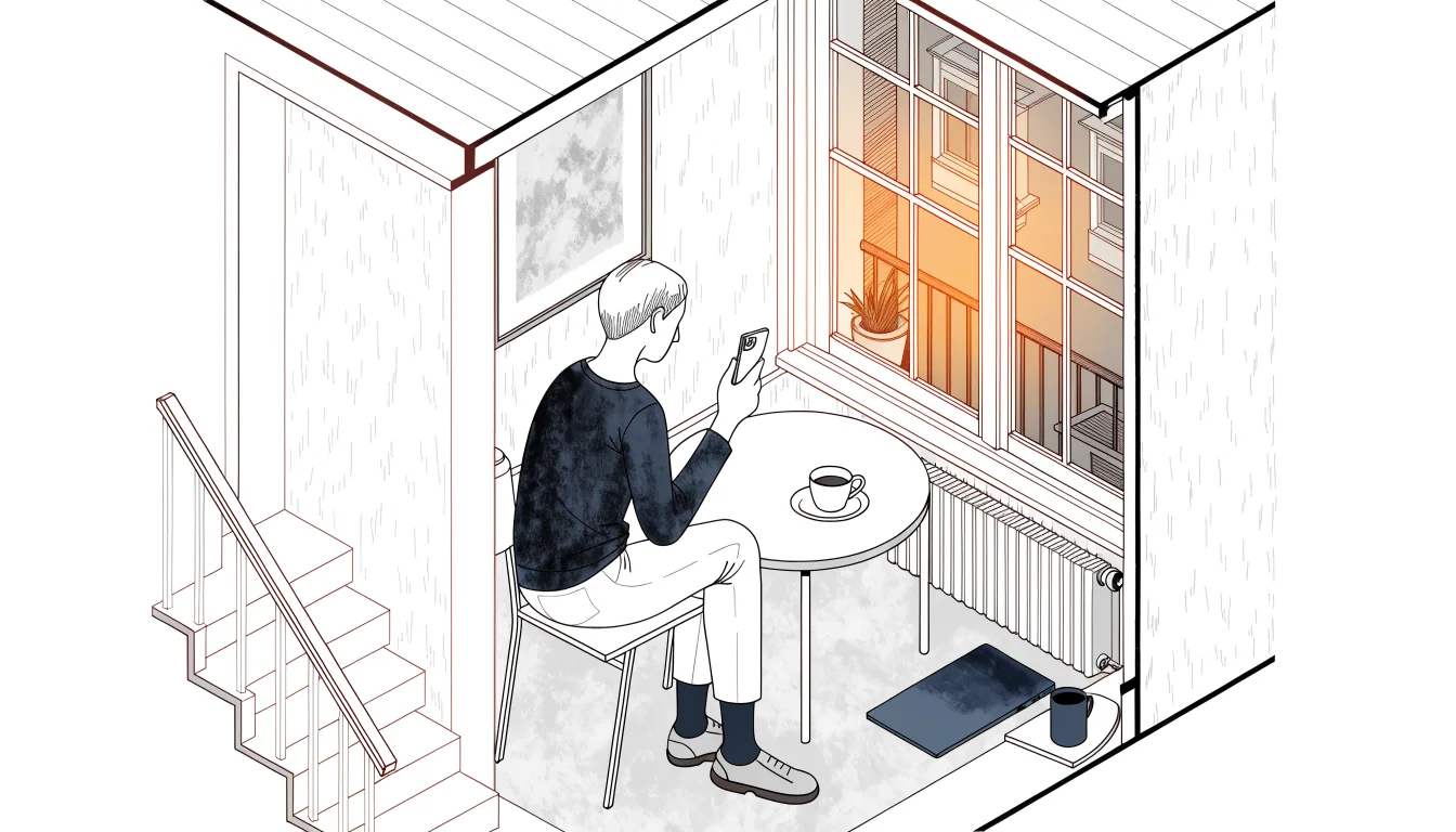 Person mit Smartphone und Kaffee in österreichischer Wohnung.